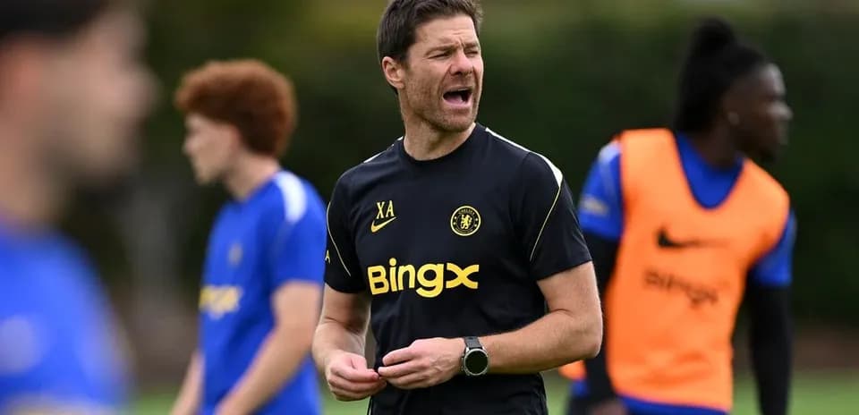 Coach directing players during training session
