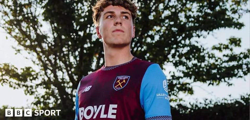 Player wearing West Ham kit outdoors