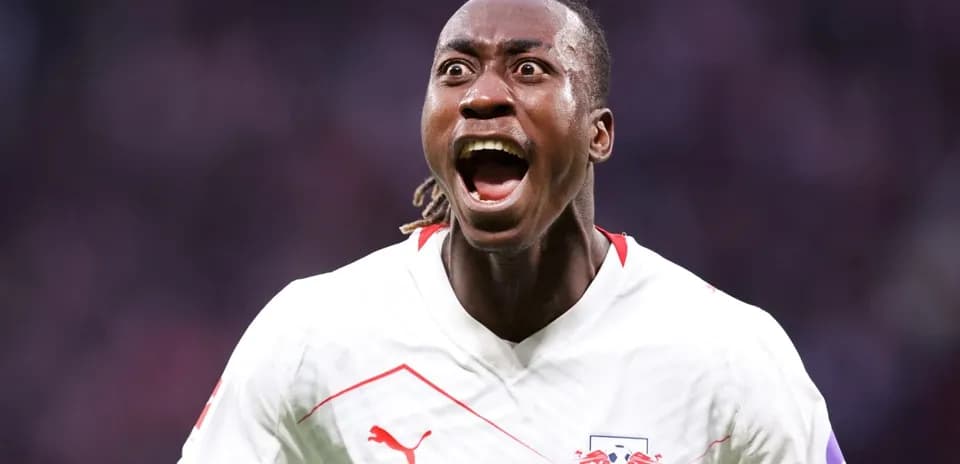 Player celebrating a goal in RB Leipzig jersey