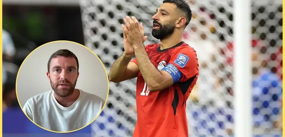 Player in red jersey clapping during match