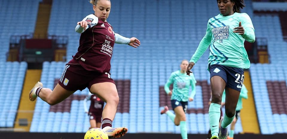 Player shooting the ball during WSL match