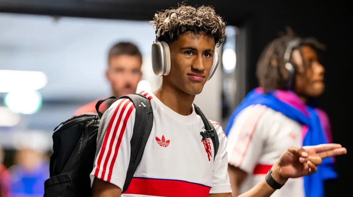 Player wearing headphones walking in locker room