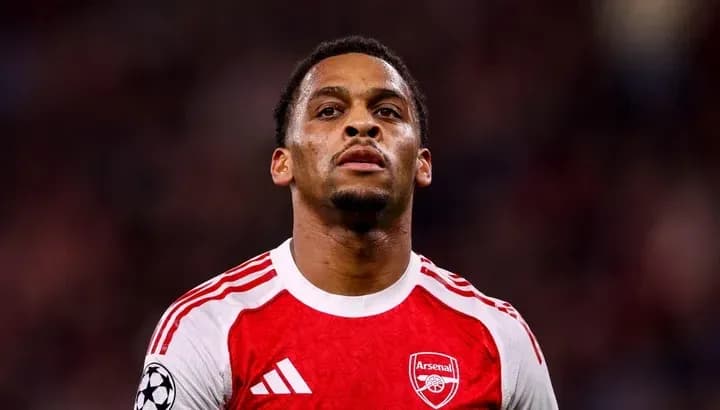 Arsenal player in red jersey on the pitch