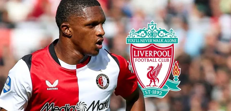 Feyenoord player with Liverpool logo in background