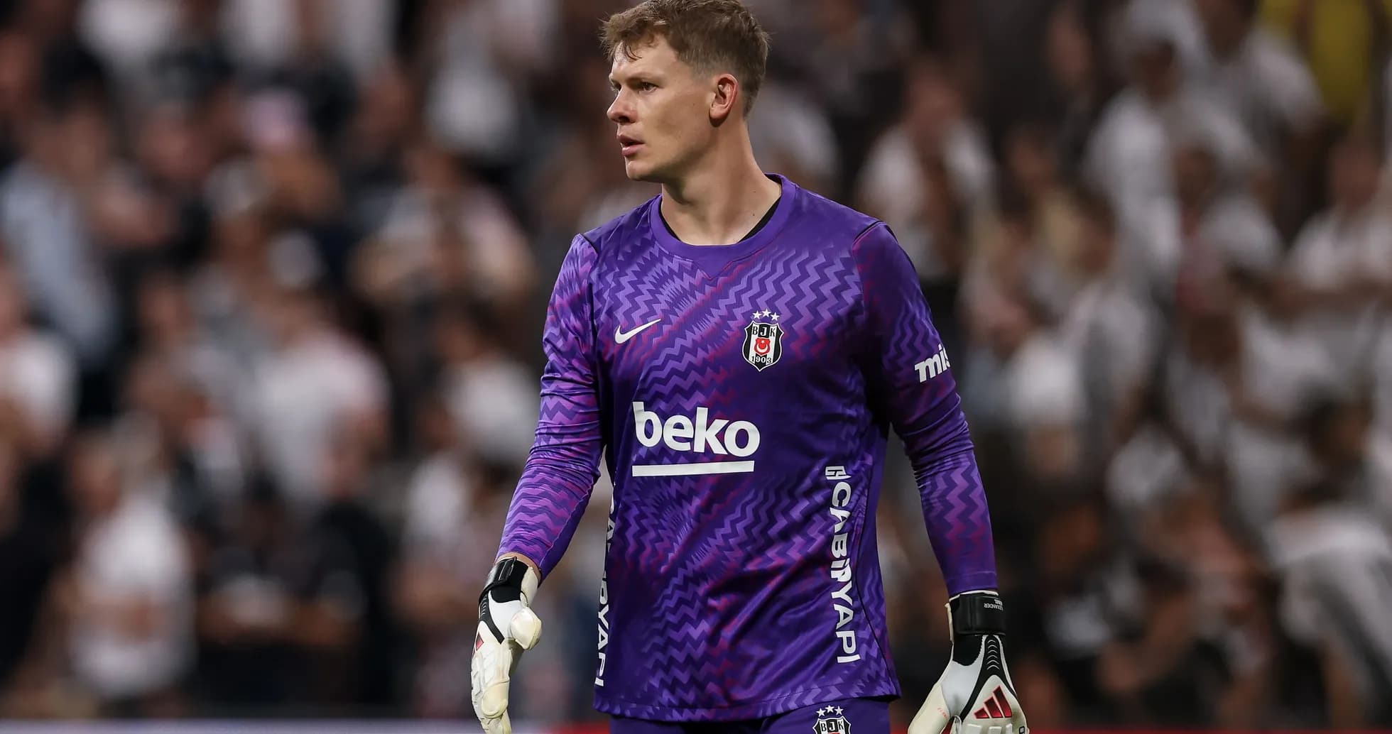Goalkeeper in purple kit during match