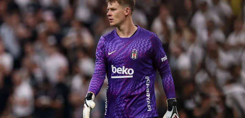 Goalkeeper in purple kit during match