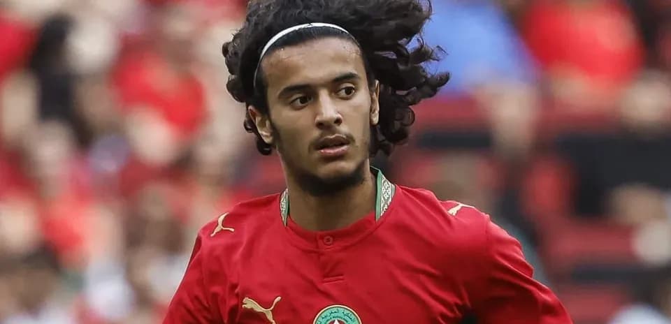 Moroccan player running on the field during match