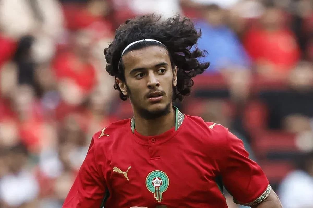 Moroccan player running on the field during match
