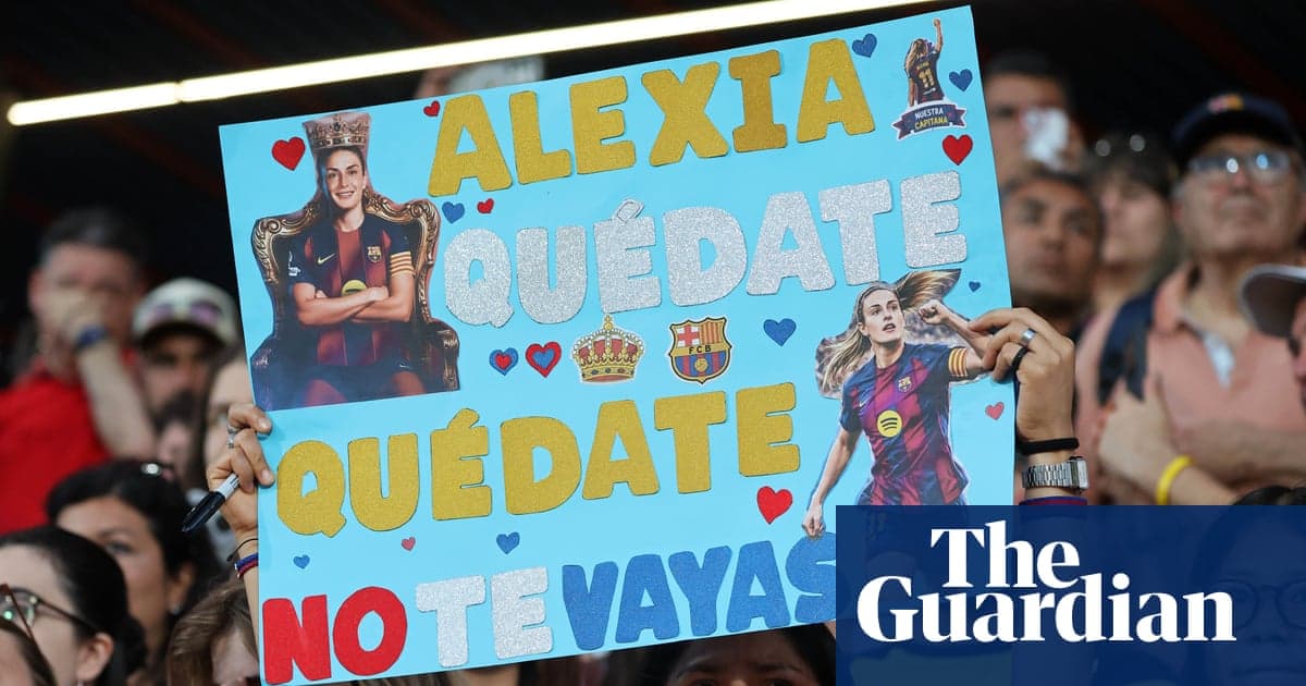Fan holding sign supporting player at stadium