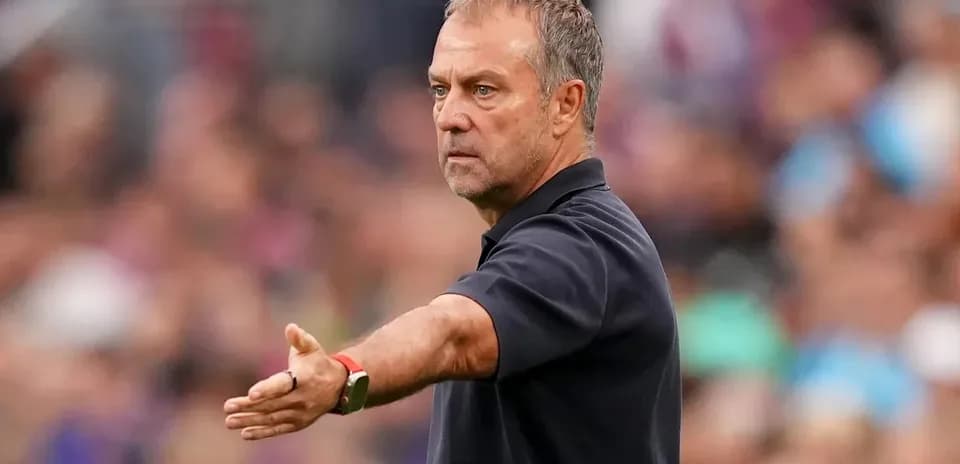 Coach gesturing during a match on the sidelines