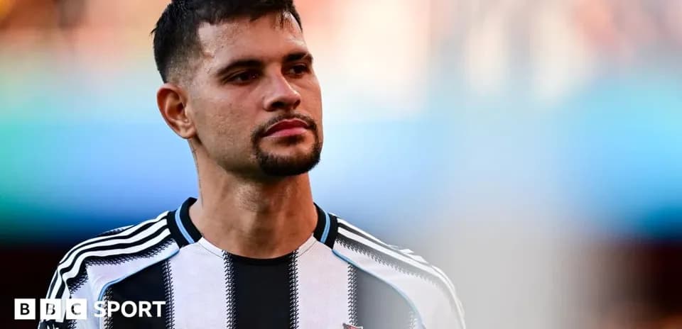 Player wearing Newcastle United jersey on the field