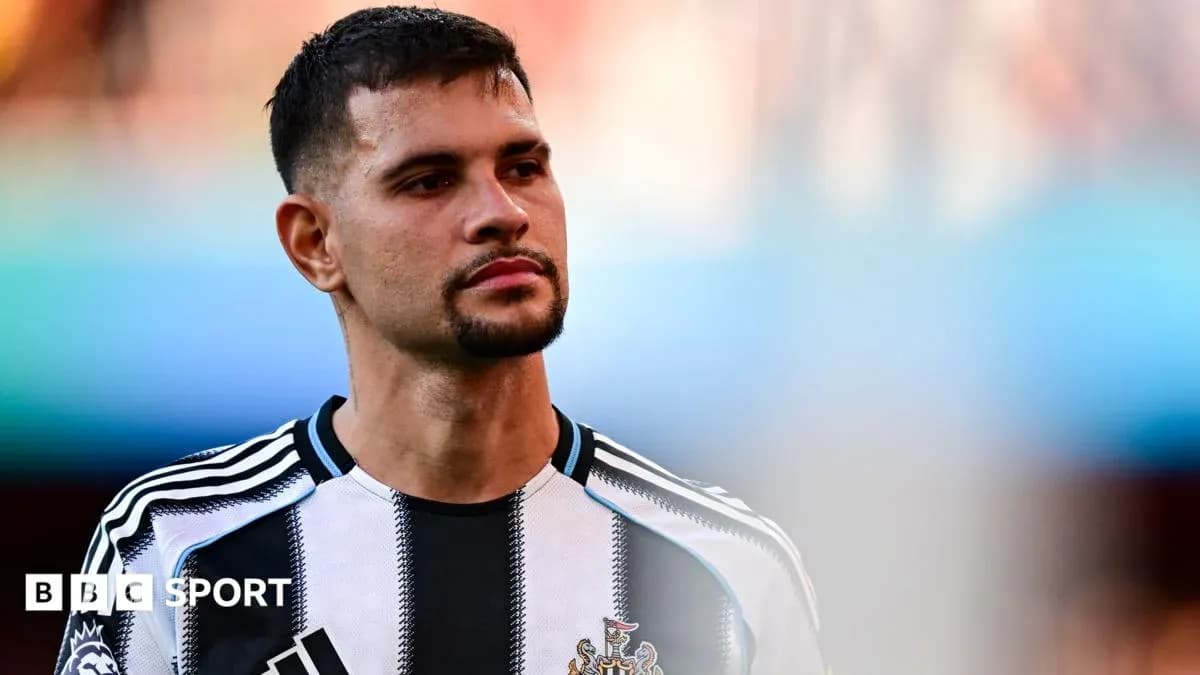 Player wearing Newcastle United jersey on the field