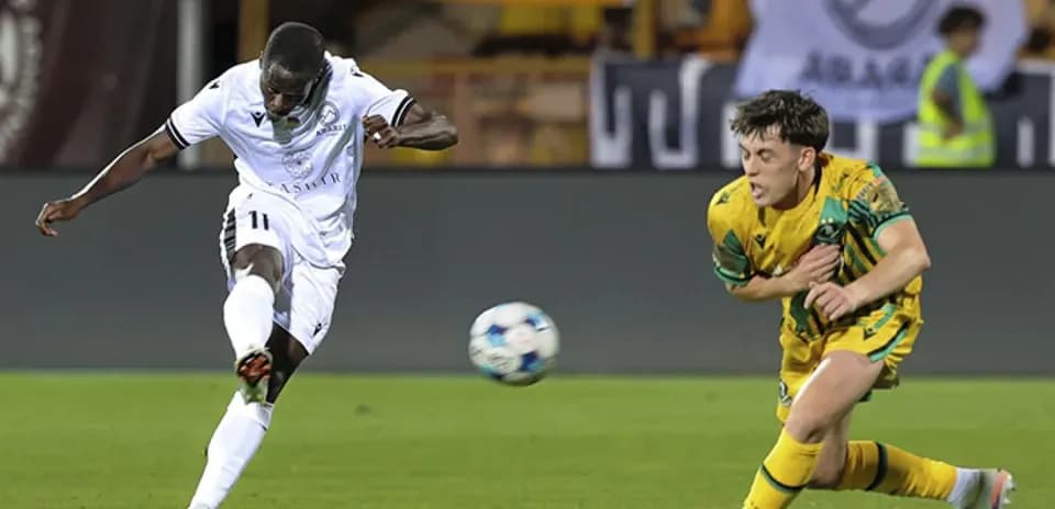 Player shooting the ball during match