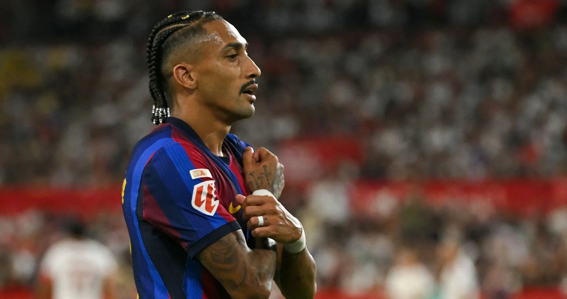 Player in FC Barcelona jersey during match action