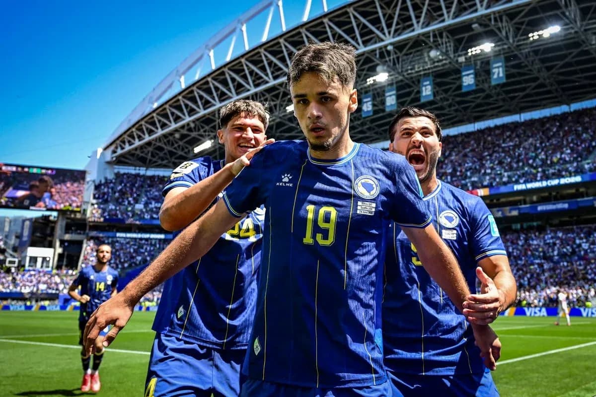 Bosnia players celebrating a goal during a match Bosnia players celebrating a goal during a match