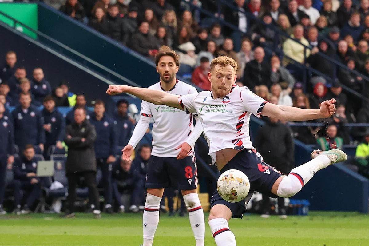 Bolton player striking the ball during match Bolton player striking the ball during match