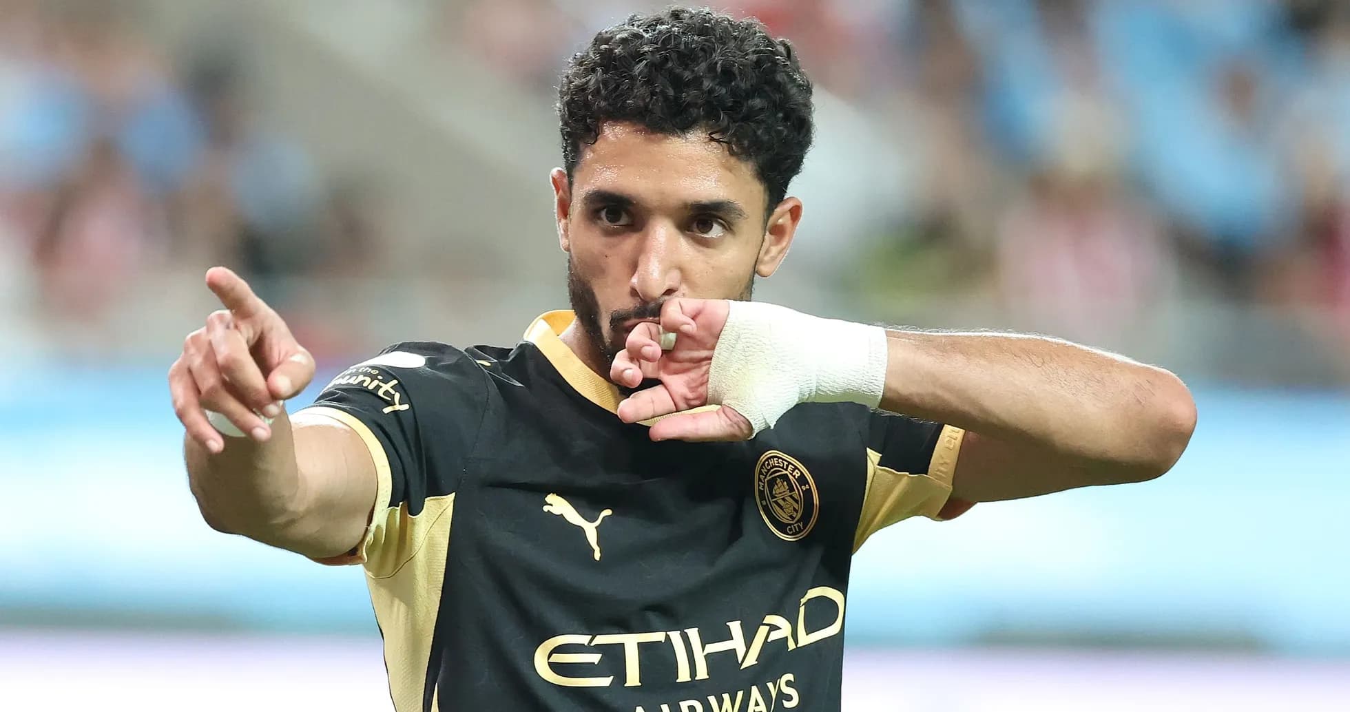 Player celebrating and pointing during a match Player celebrating and pointing during a match