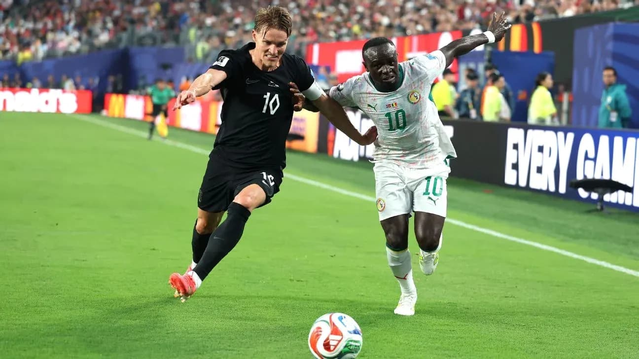 Two players contesting for the ball during match Two players contesting for the ball during match