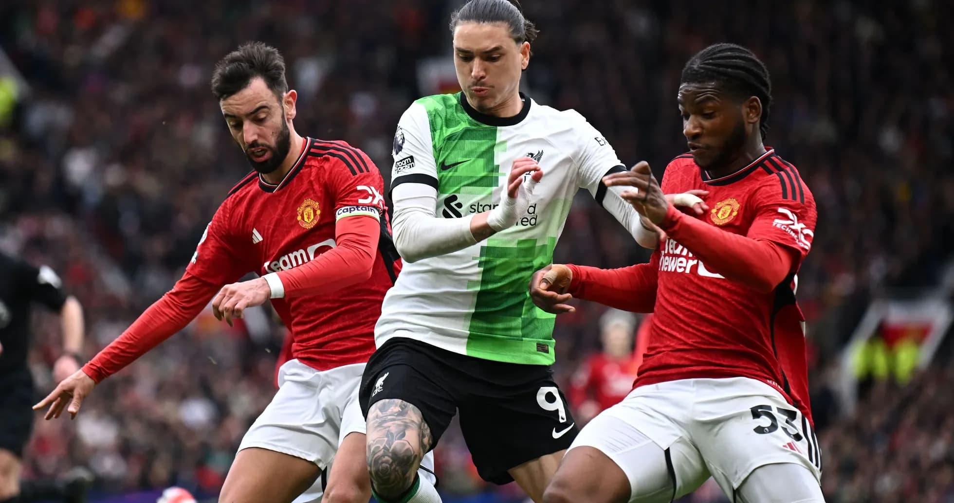 Darwin Núñez challenged by two Manchester United players Darwin Núñez challenged by two Manchester United players
