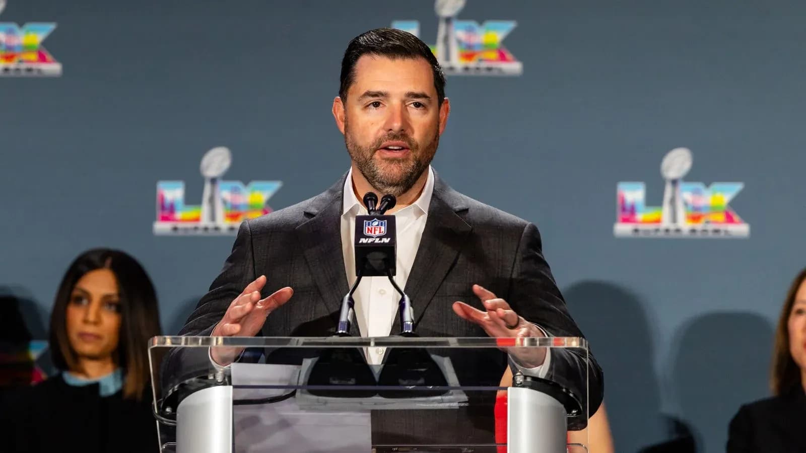 Speaker at podium during NFL press conference Speaker at podium during NFL press conference