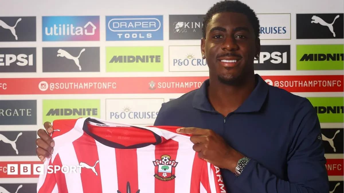 Player holding Southampton FC jersey at press conference Player holding Southampton FC jersey at press conference