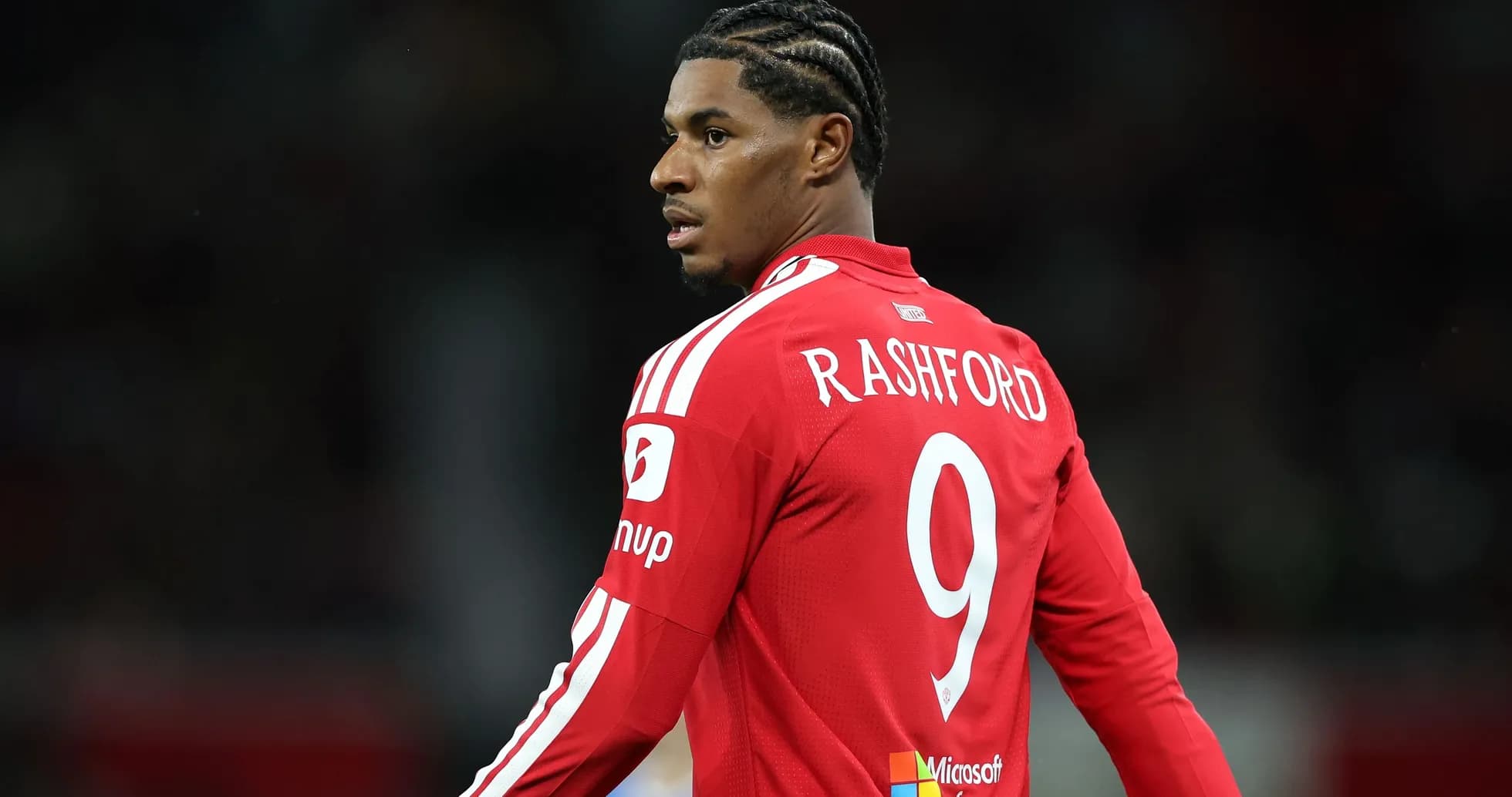 Player in red jersey with number 9 on back Player in red jersey with number 9 on back