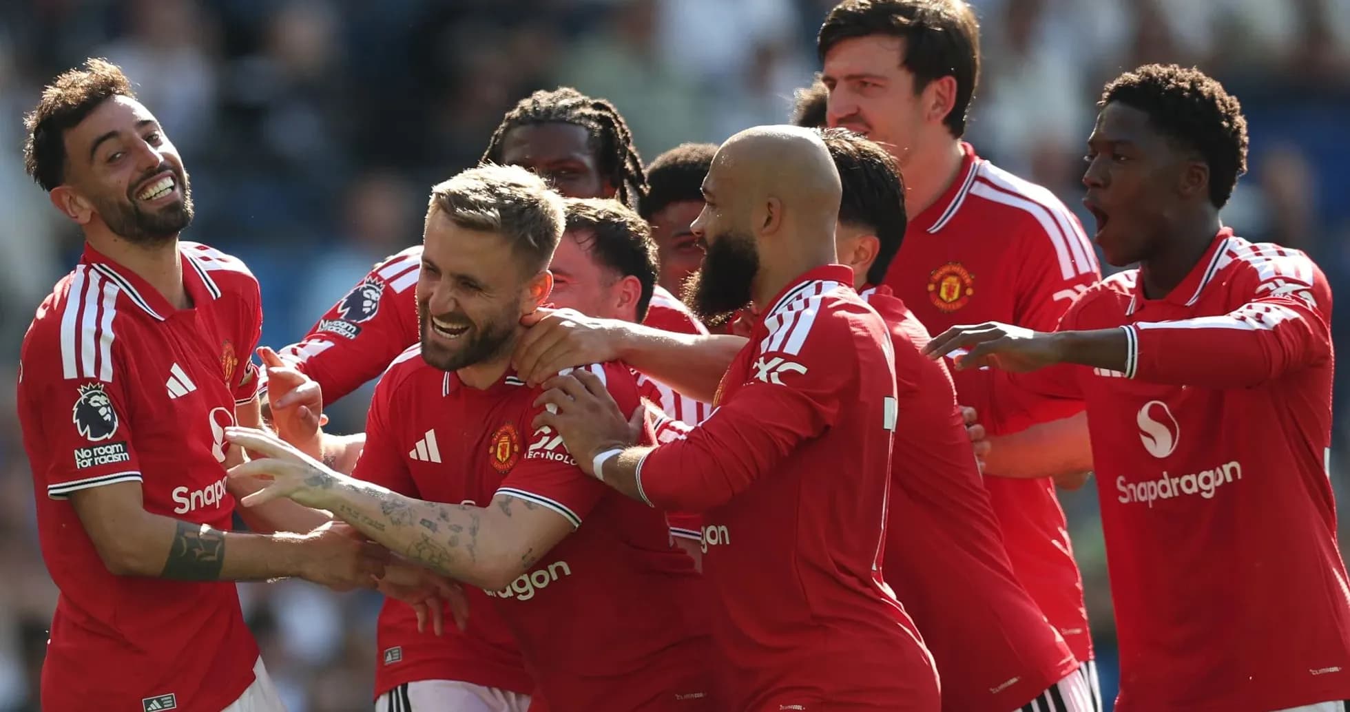 Manchester United players celebrating a goal together Manchester United players celebrating a goal together