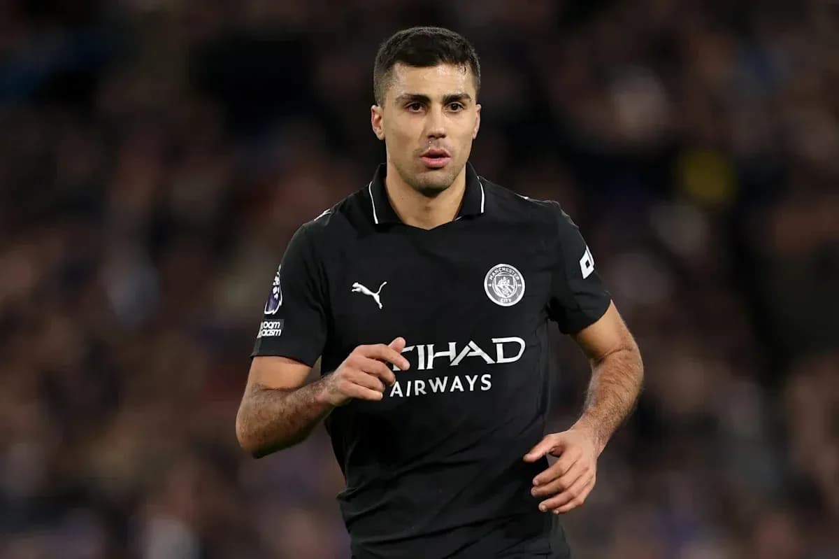 Player running in Manchester City black kit Player running in Manchester City black kit