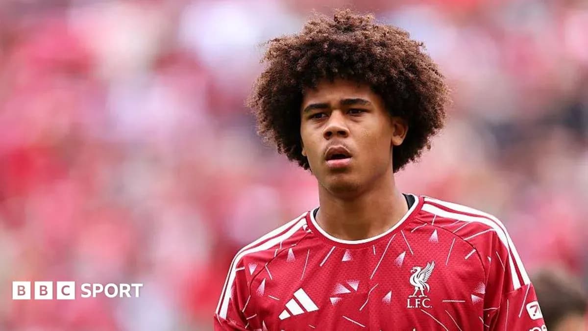 Young player in Liverpool FC jersey during match Young player in Liverpool FC jersey during match