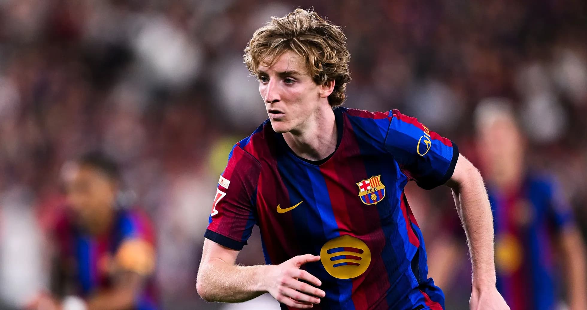 Player running during a FC Barcelona match Player running during a FC Barcelona match