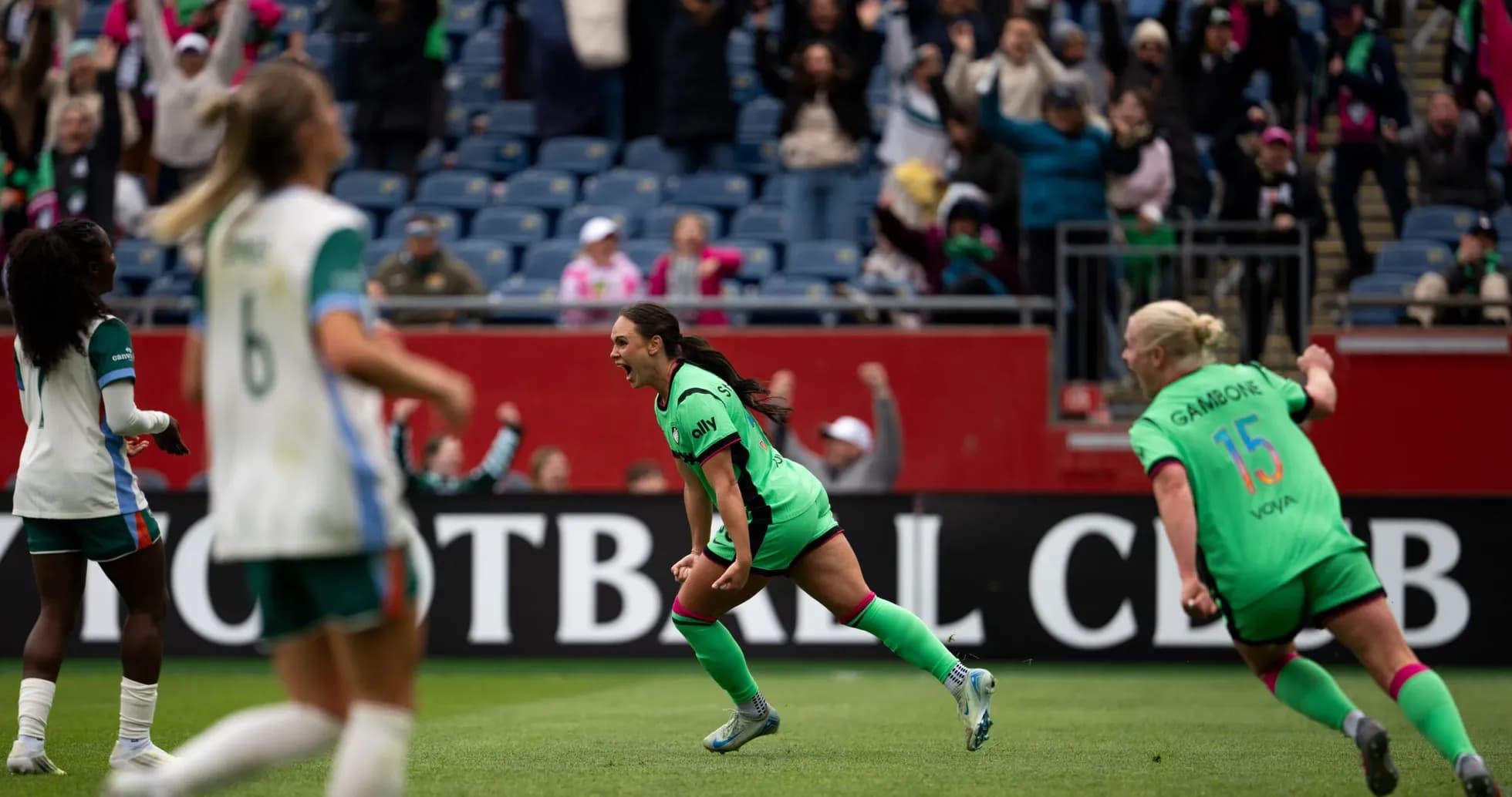 Kansas City W players celebrating a goal Kansas City W players celebrating a goal