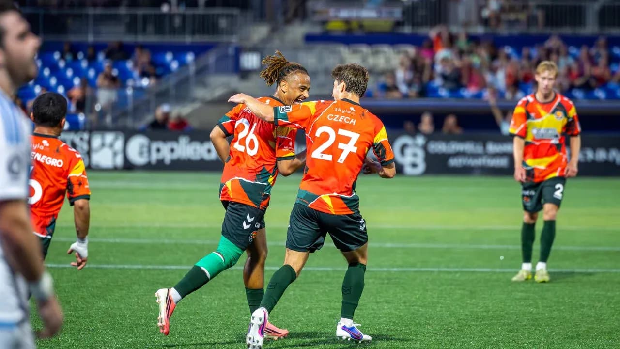 Players celebrating a goal during match Players celebrating a goal during match