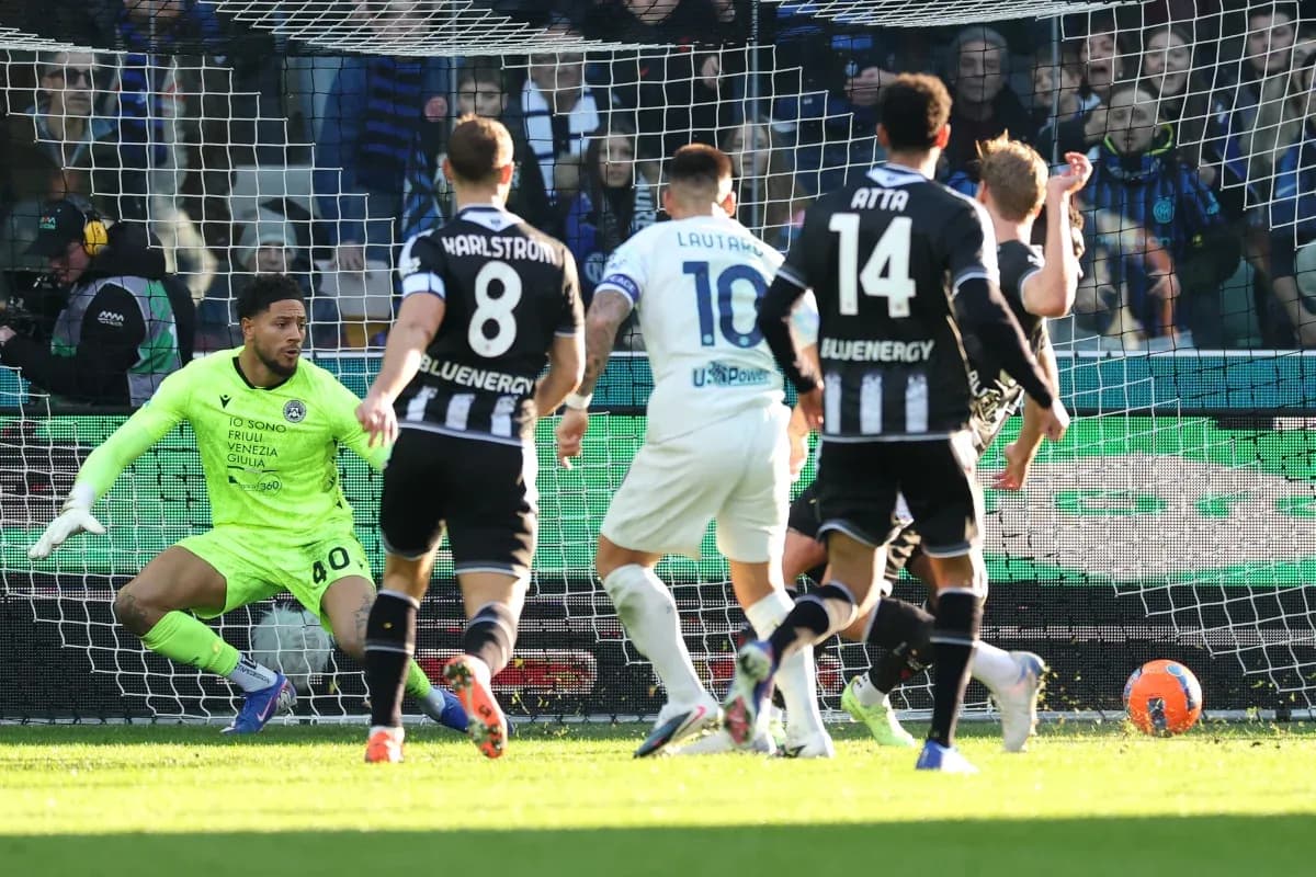 Udinese goalkeeper saving a shot during match Udinese goalkeeper saving a shot during match