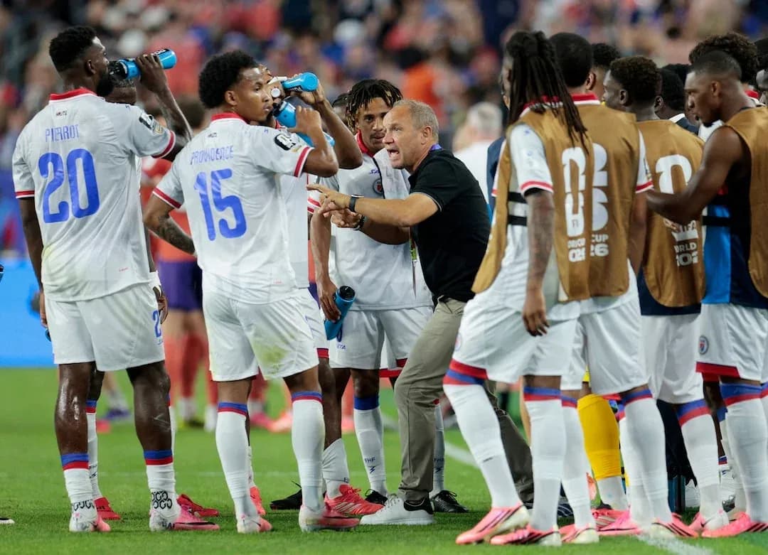 Haiti team discussing strategy during match Haiti team discussing strategy during match