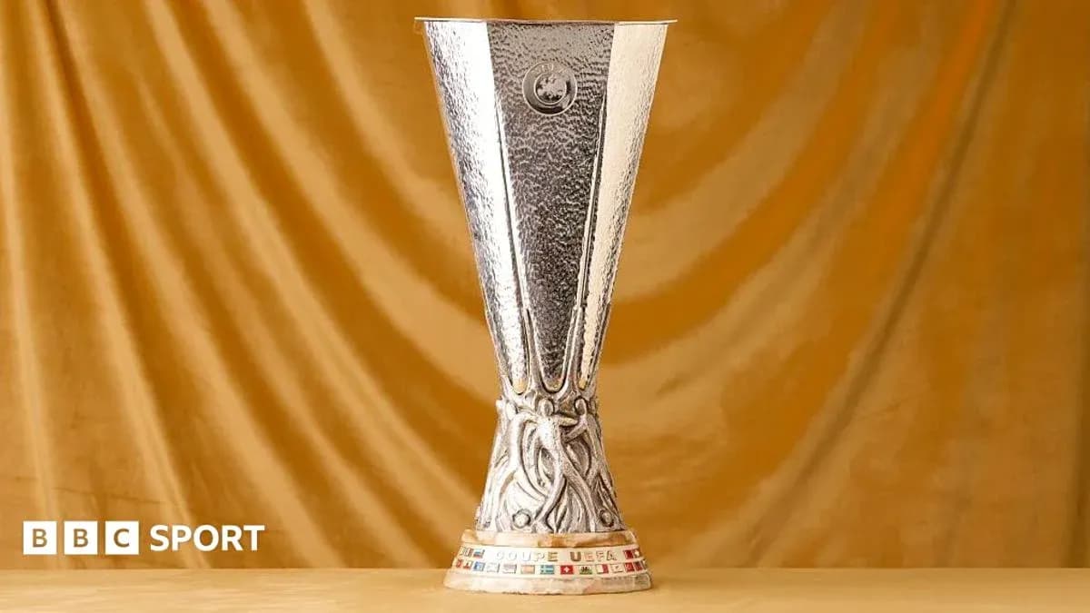 UEFA Europa League trophy on a golden background UEFA Europa League trophy on a golden background