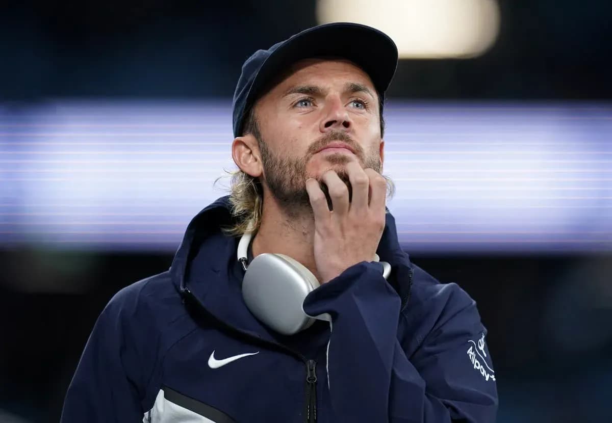 Man in jacket and cap looking thoughtfully Man in jacket and cap looking thoughtfully