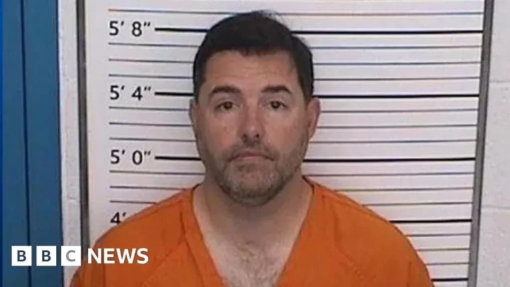 Mugshot of a man in orange jumpsuit Mugshot of a man in orange jumpsuit