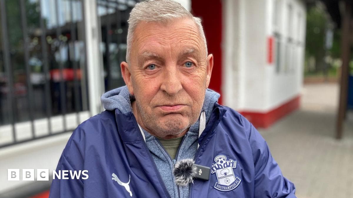 Man wearing Southampton FC jacket outdoors Man wearing Southampton FC jacket outdoors