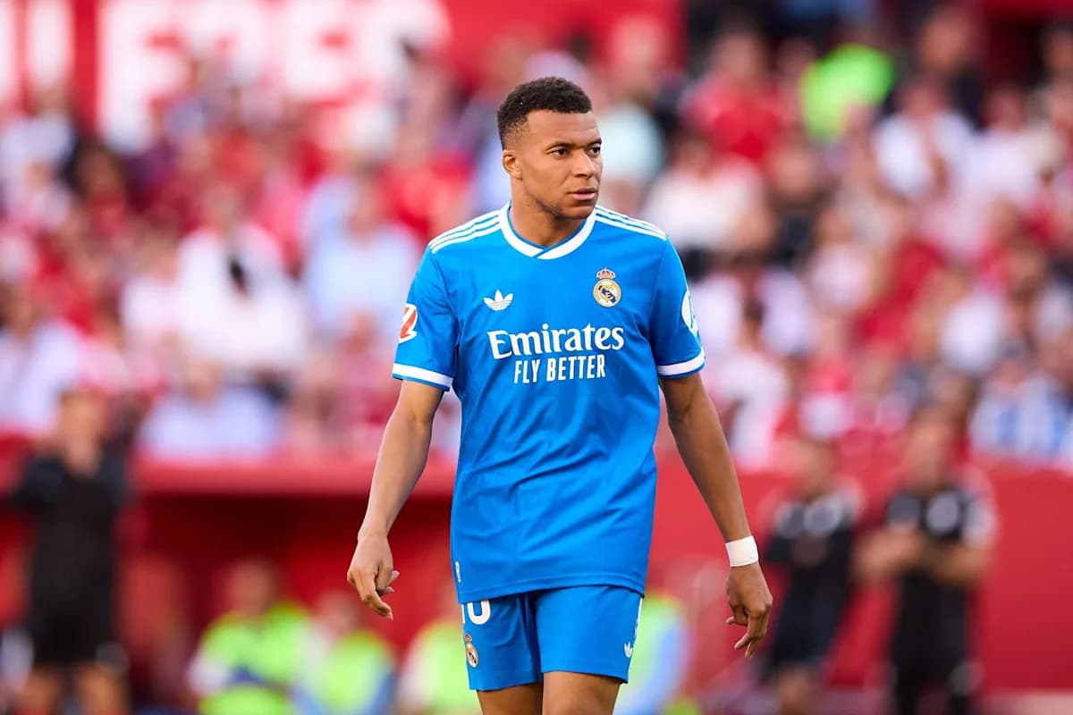 Player in blue kit walking on the pitch Player in blue kit walking on the pitch