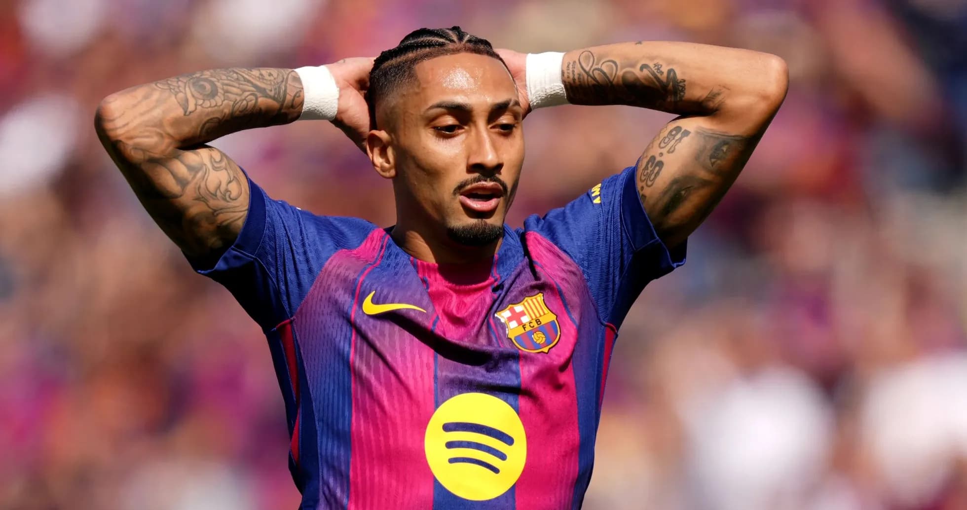 Player with tattoos reacting during a match Player with tattoos reacting during a match