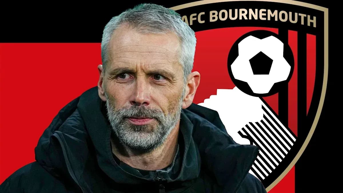 AFC Bournemouth manager with club logo background AFC Bournemouth manager with club logo background