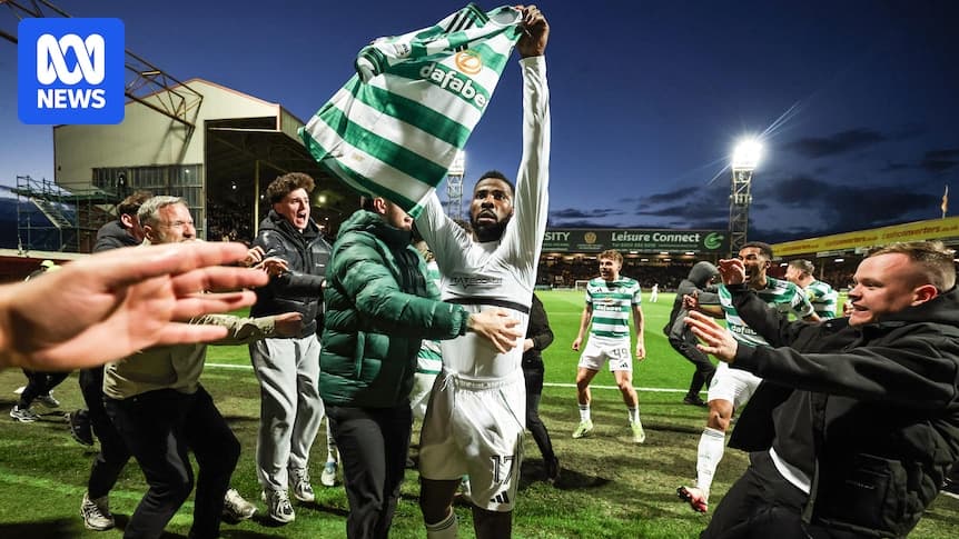 Player celebrating with fans after match victory Player celebrating with fans after match victory