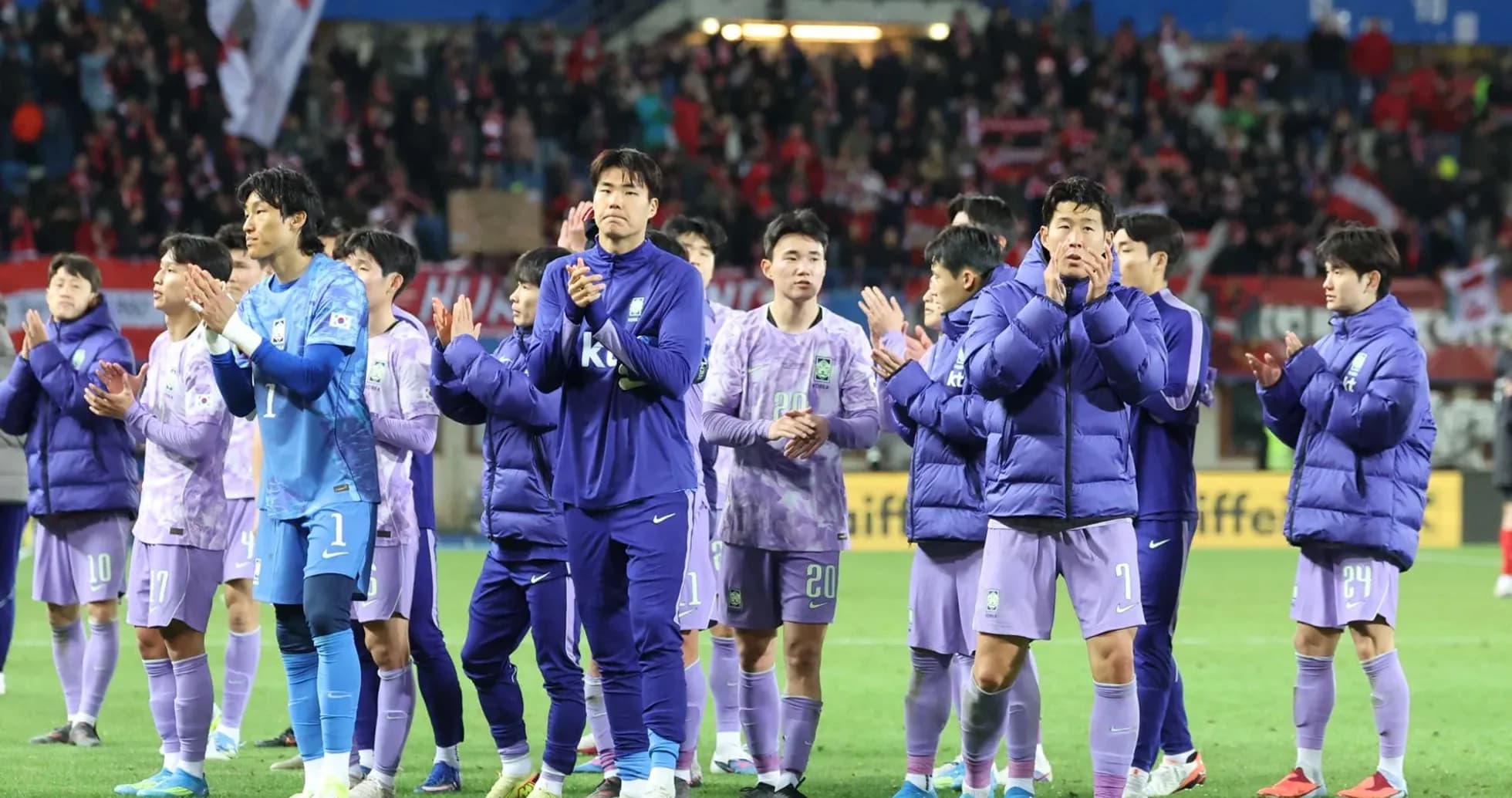Players applauding fans after the match Players applauding fans after the match