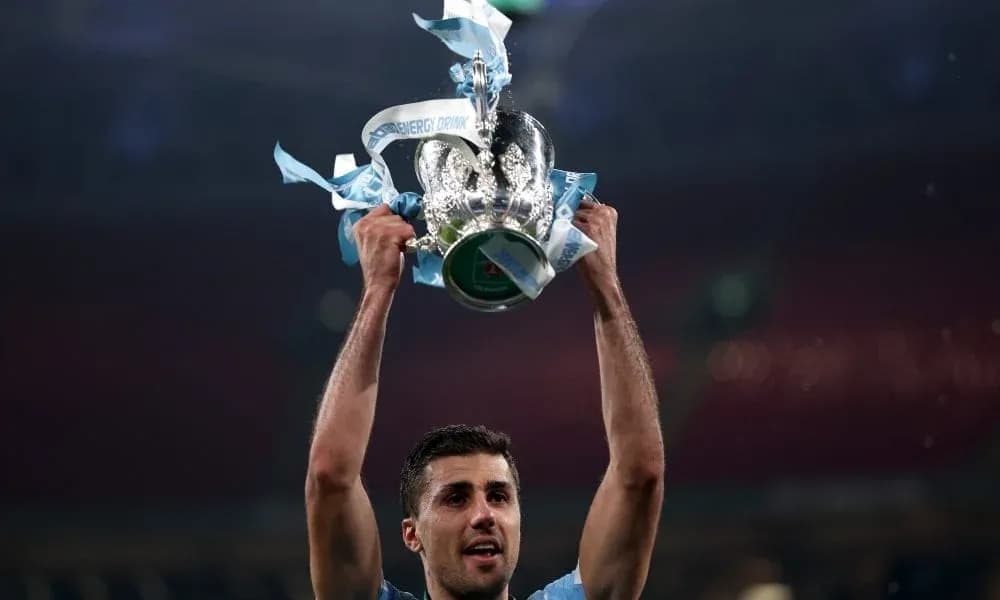 Player holding trophy aloft after victory Player holding trophy aloft after victory