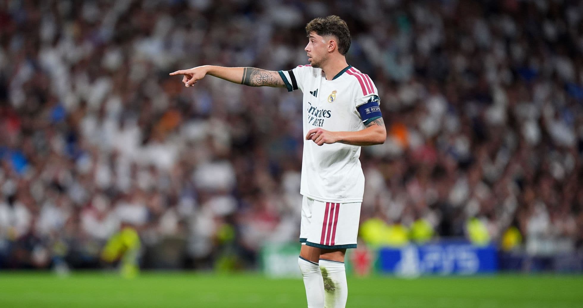 Player gesturing during a match at the stadium Player gesturing during a match at the stadium
