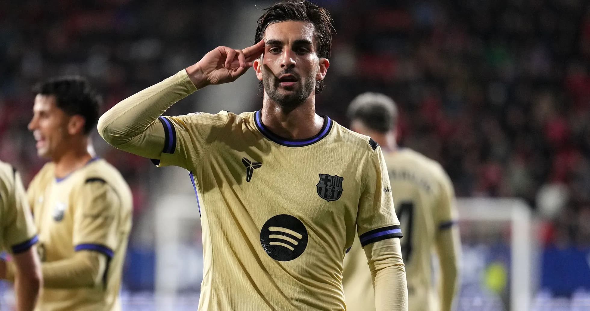 Player celebrating a goal with a salute gesture Player celebrating a goal with a salute gesture