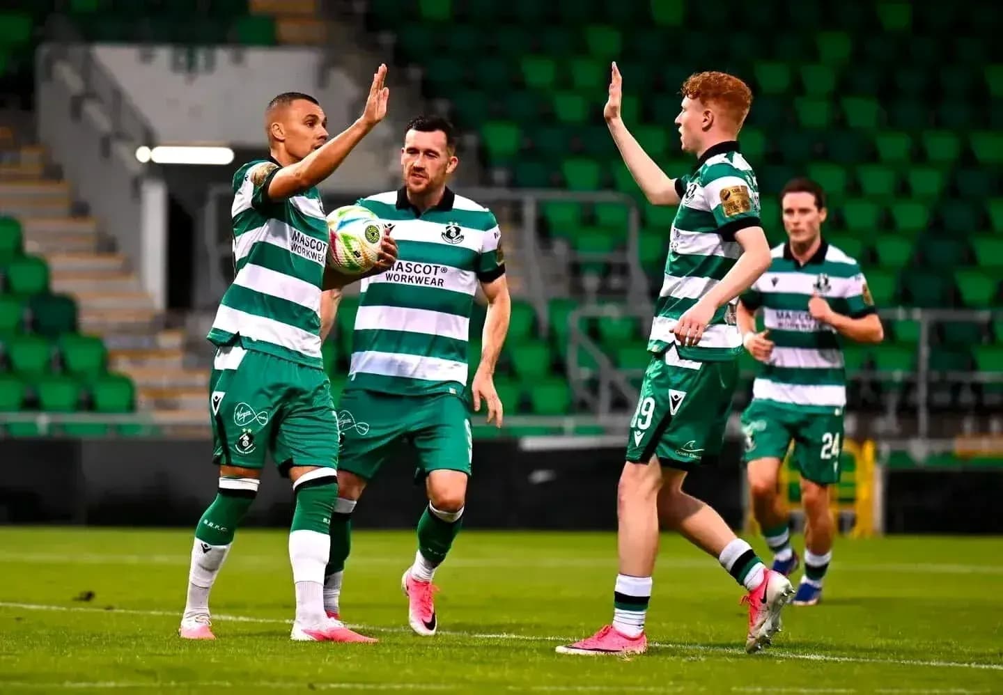 Shamrock Rovers players celebrating a goal Shamrock Rovers players celebrating a goal