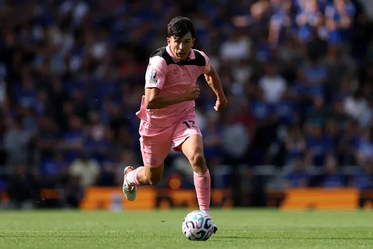 Player running with the ball during a match Player running with the ball during a match