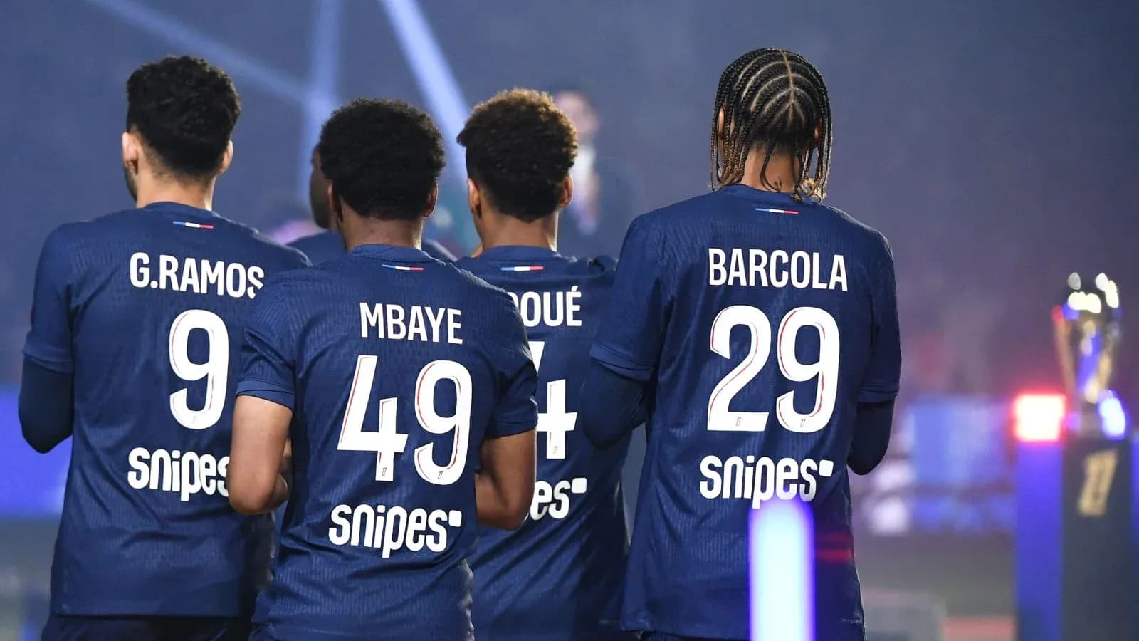 Four players showing their jerseys from behind Four players showing their jerseys from behind