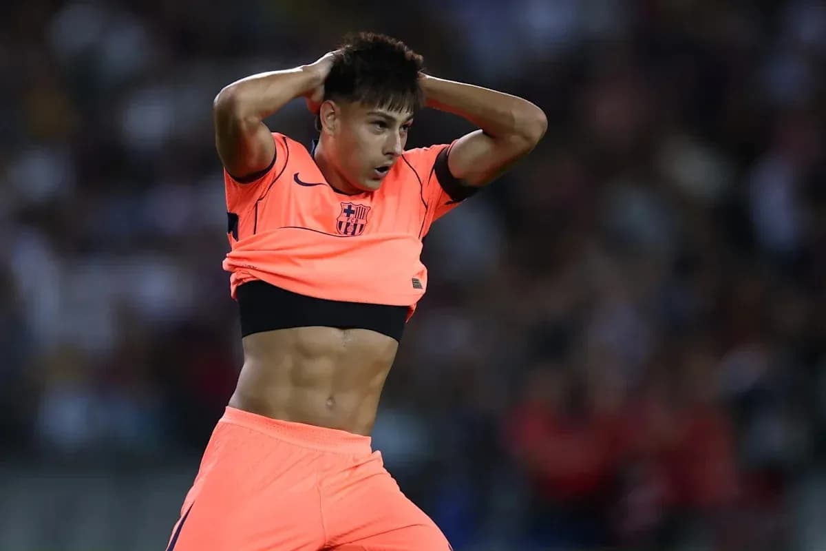Player adjusting jersey during football match Player adjusting jersey during football match